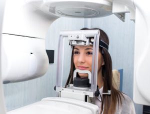 Girl taking digital 3D panoramic dental x-ray.